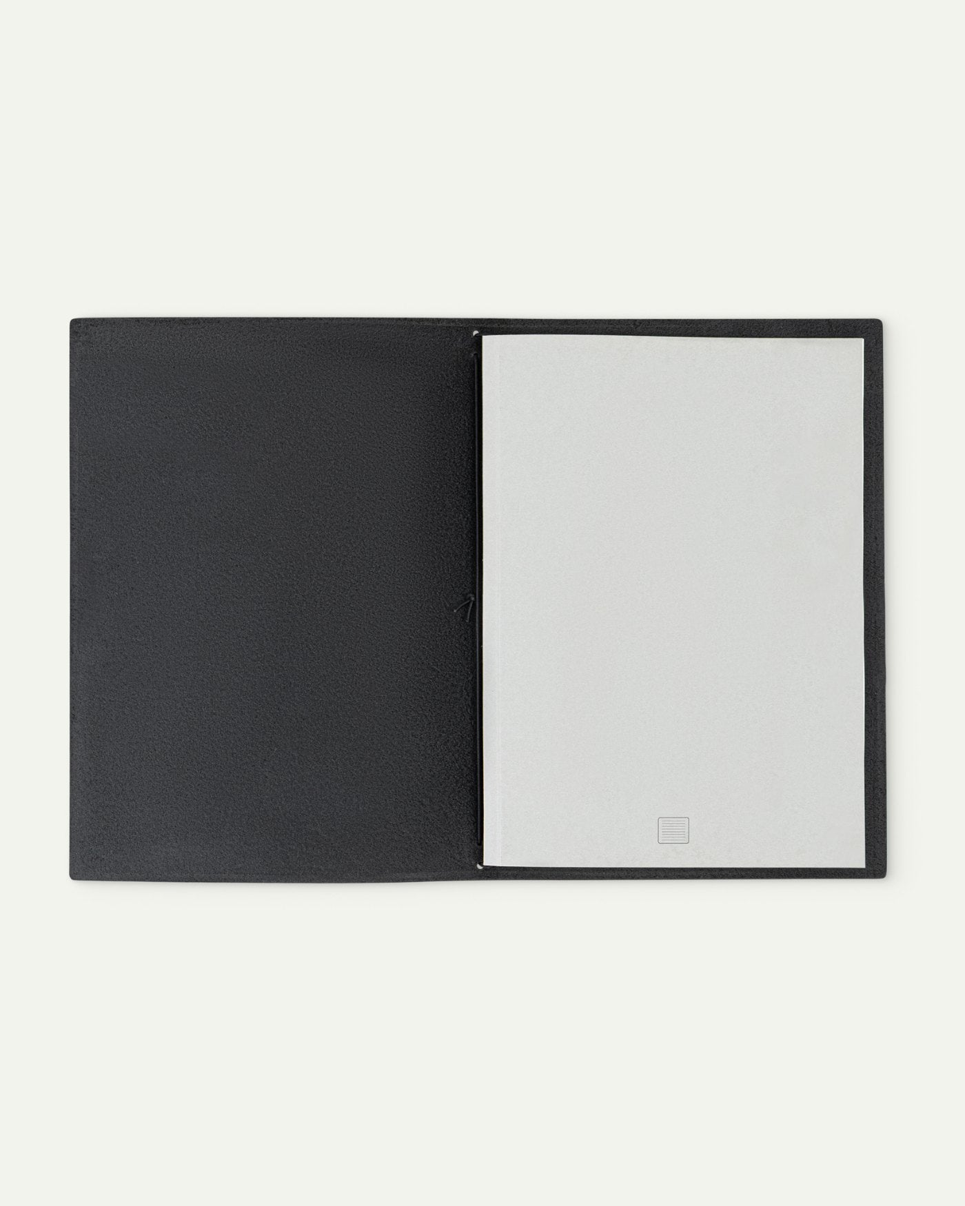 Leather Cover in Black, open with a grey notebook